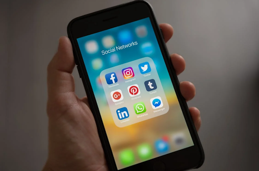 Social media apps in a folder on a phone